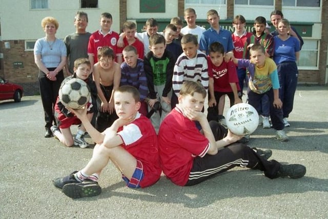 Parents fed up with vandalism and crime on a run-down Preston estate have set up their own football teams in a bid to keep bored youngsters off the street. Mums Janice Burns and Lynn Carter claim the Avenham area of the town has been hit by problems because children have nothing to do. Pictured is Michael Doyle and James Burns with the other youngsters of the Avenham area of Preston who are appealing for sponsorship to help set up two football teams