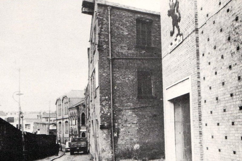 Syke Street, Avenham, Preston c.1950
To the left, behind the wall, is the former premises of Preston Gas Works. Just right of centre is the entrance to Old Cock Yard. The River Syke, culverted since 1812 runs directly below the photographer. This watercourse will eventally find it's way west, passing below the subway at Preston Railway Station and discharge into the Ribble at the bottom of Fishergate Hill.