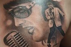 Has the king of rock 'n' roll Elvis Priestly etched on his chest