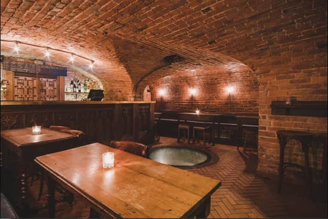 Inside the vaults of the Plau bar - with a restored glass-topped 43-foot well in the centre of the floor.