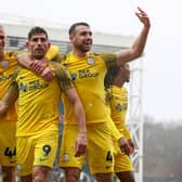 Preston North End's Ched Evans celebrates scoring his side's third goal against Blackburn Rovers