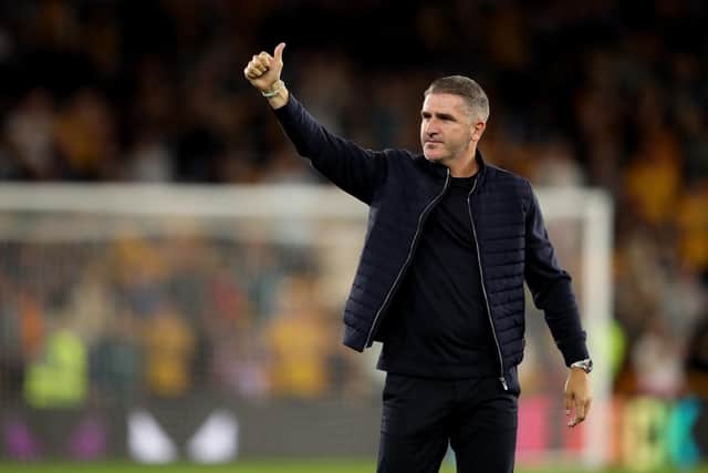 PNE boss Ryan Lowe salutes the fans after the Wolves game.