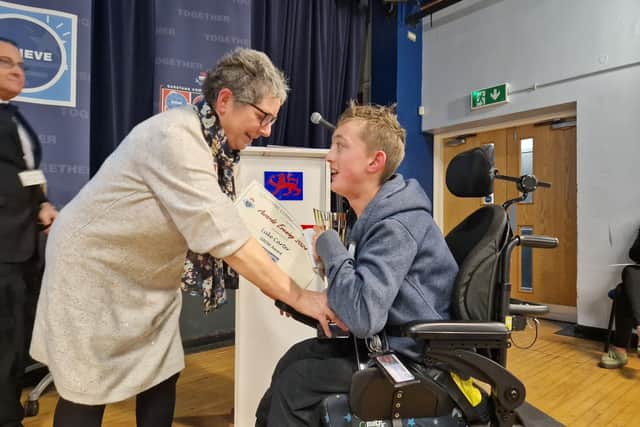 Luke Carter receives the Grow award from Julie Parkinson