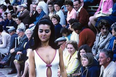 A busy swimming stadium for a 1960s Miss GB competition.