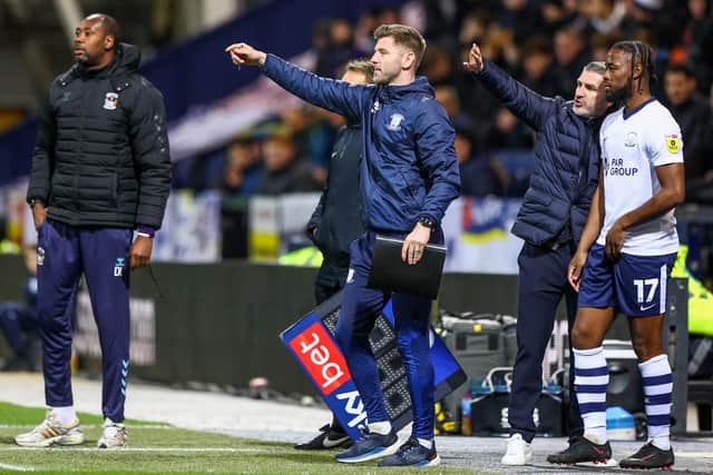 Preston North End’s assistant coach Paul Gallagher shouts instructions to his team from the technical area, with Ryan Lowe talking to Josh Onomah
