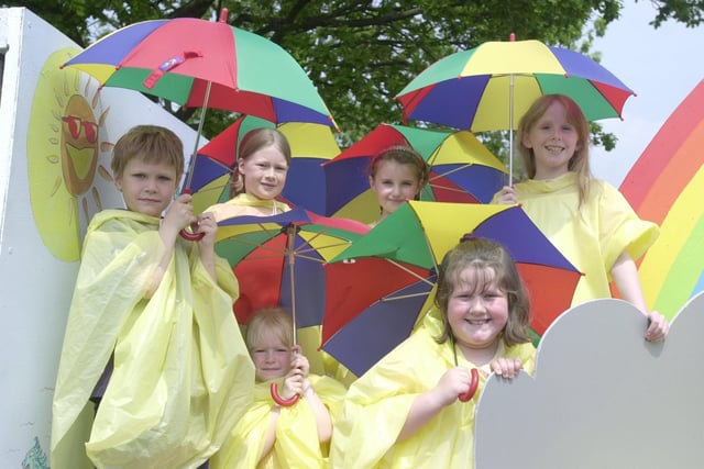 St Francis RC School were prepared just in case it rained on their 'Our Wonderful Weather' float. Pictured are Megan Blair, Louise Peel, Alice Cowell, Peter Mather, Charlotte Gardner and Stephanie Butcher
