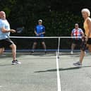 Pickleball players take part in a doubles match in Chorley