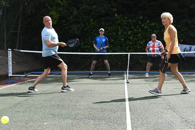 Pickleball players take part in a doubles match in Chorley