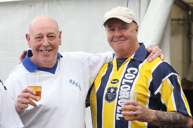 Two fans sports PNE replica shirts from yesteryear