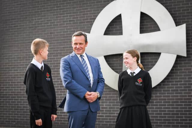 Holy Cross pupils pictured with headteacher, Ivan Gaughan, who says he is "delighted" by the report.