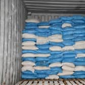 The drugs, which weighed 1.3 tonnes, were discovered in a shipping container at the Port of Felixstowe, Suffolk, after they had arrived from Sierra Leone in west Africa. The class A drugs had a street value of £140m and were hidden in 20 kilo sacks with a cover load of flour and were destined to be delivered to an industrial estate in Wigan, Lancashire.