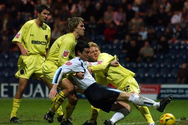 Preston North End striker David Nugent stretches to reach a cross against Millwall at Deepdale
