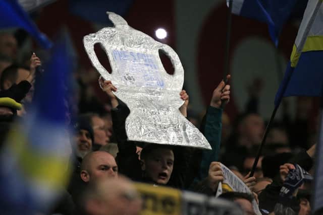 A tinfoil FA Cup is help up by a PNE fan in the crowd