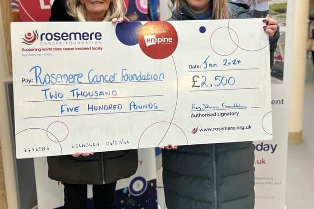 Norma (left) and Kara present Rosemere Cancer Foundation with the funds raised by their Reg Johnson 