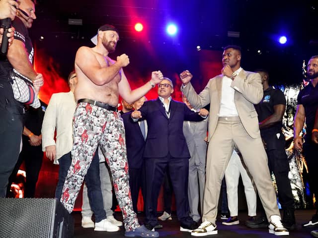 Tyson Fury (left) and Francis Ngannou (right) during a press conference (Credit: PA/ James Manning)