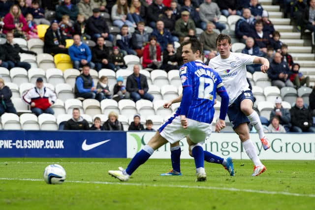Preston North End's Lee Holmes scores his sides third goal shooting past Carlisle United's Paul Thirlwell.