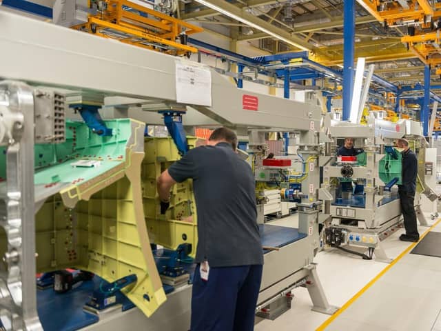 Workers at BAE Systems in Samlesbury, Lancashire, with a section of the rear fuselage for the F-35 Lightning II. 
The company's final assembly facility celebrated delivery of the 1000th aft fuselage to Lockheed Martin in February 2023.