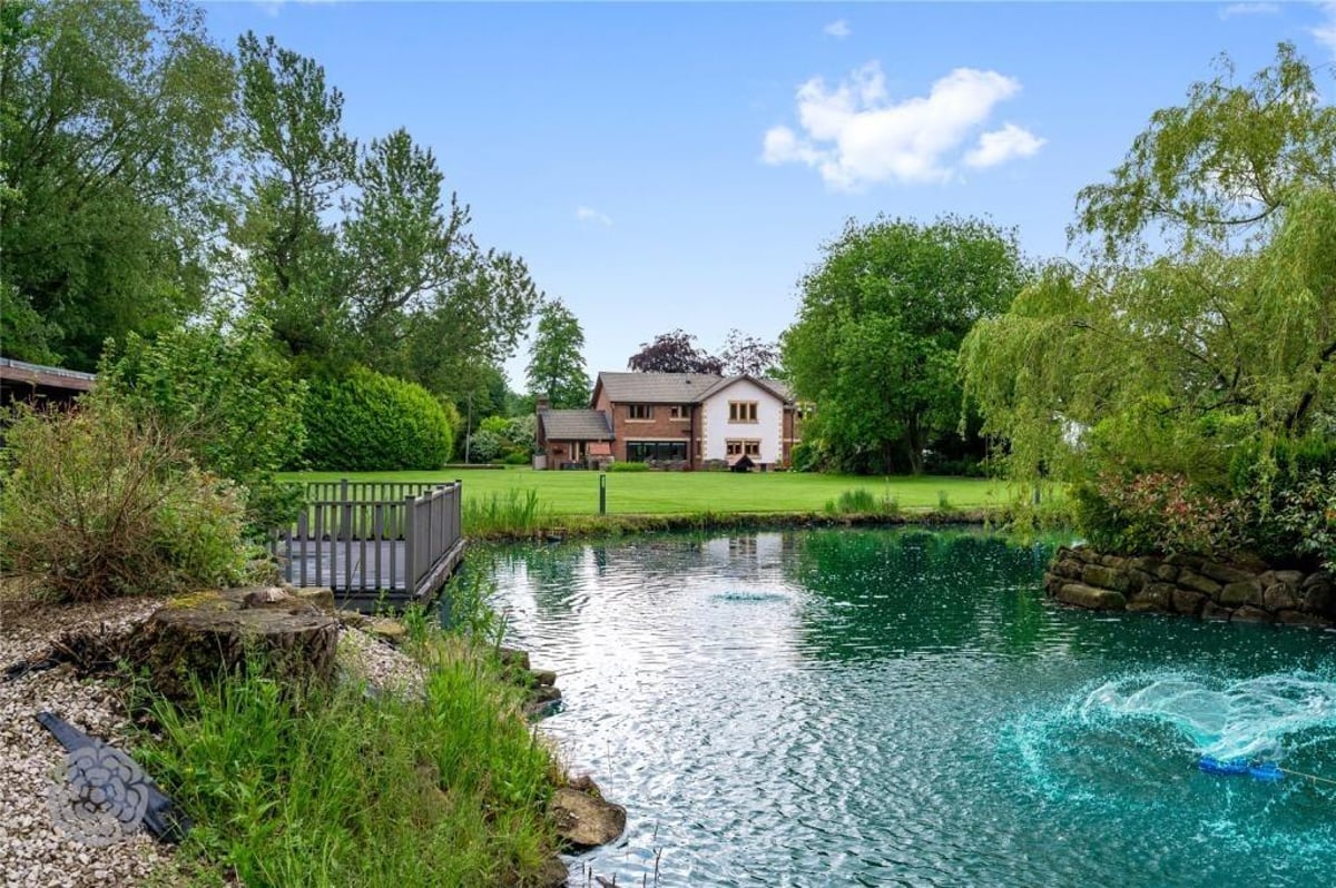 World-class family home with astonishing garden featuring a private lake and summer house on the market for £1.45m