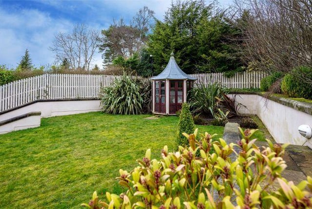 This small summer house would be a perfect hide and seek spot with stunning views across the garden.