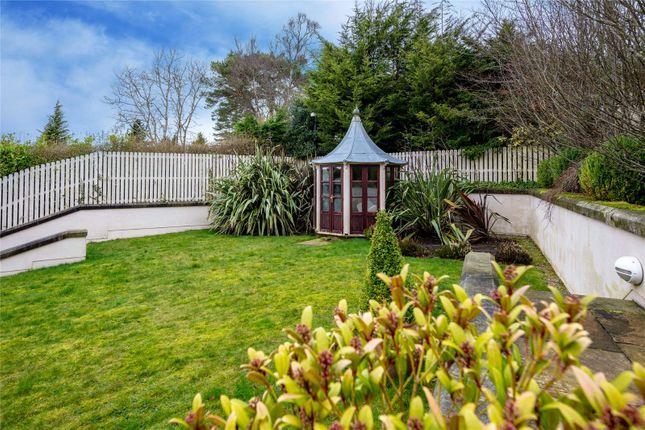 This small summer house would be a perfect hide and seek spot with stunning views across the garden.