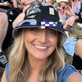 Kirsty Manley at Glastonbury wearing the PNE hat she found. She now hopes to reunite the hat with its owner