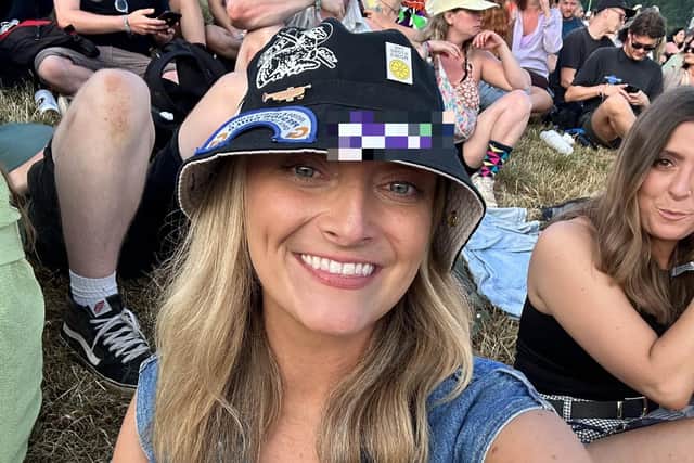 Kirsty Manley at Glastonbury wearing the PNE hat she found. She now hopes to reunite the hat with its owner