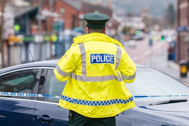 A man was robbed at knifepoint after he stopped to help a woman in Chorley