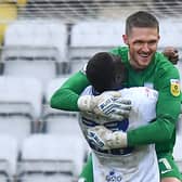 Preston North End's Freddie Woodman and Bambo Diaby celebrate at the final whistle on Saturday