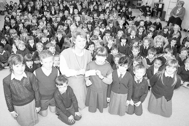 All 230 pupils at a primary school turned out to present a cheque to the local blind association. Children at Pool House County Primary at Ingol, Preston, have spent the past two weeks selling bookmarks to friends and relatives to raise money for the blind. Mrs Pat Buckley, county co-ordinator for the Royal National Institution for the Blind, received the cheque from pupils