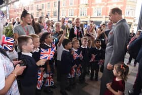 Prince Edward meets some youngsters on his visit to the city