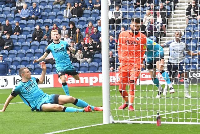 Millwall's Murray Wallace puts through his own goal to give Preston North End the lead at Deepdale