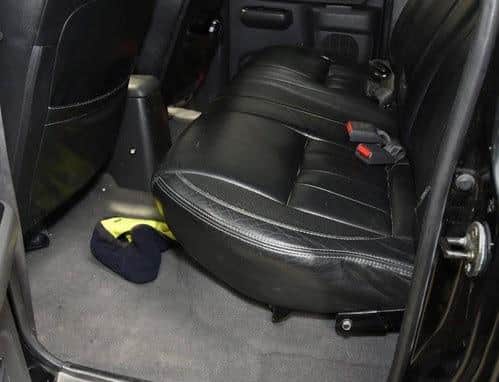 A navy blue and yellow snood which was found inside the abandoned getaway car contained traces of Burtak’s DNA. (Credit: Lancashire Police)
