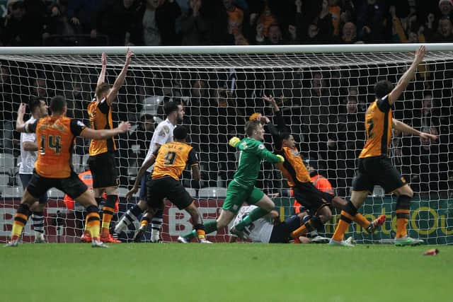 Preston North End's John Welsh clears off the line in the last minute as Hull City's playes claim a goal.