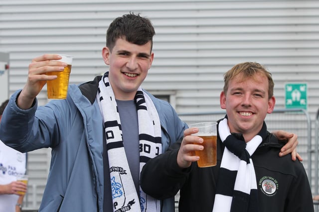 Two PNE fans enjoy a pre-match pint in the fan zone