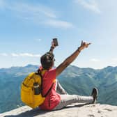 A growing number of people are taking risks when they take selfies. Photo: Adobe