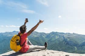 A growing number of people are taking risks when they take selfies. Photo: Adobe