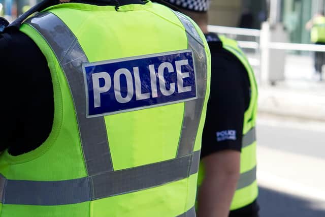 Two men were arrested after a police constable received racially abusive messages