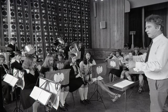 These days - 1975 -  violins and trumpets lie alongside satchels and briefcases in the corridors of Lancashire schools - all because of a far more sophisticated form of musical eduction. Pictured above are the Tulketh High School band, under the watchful baton of music teacher Mr Rees