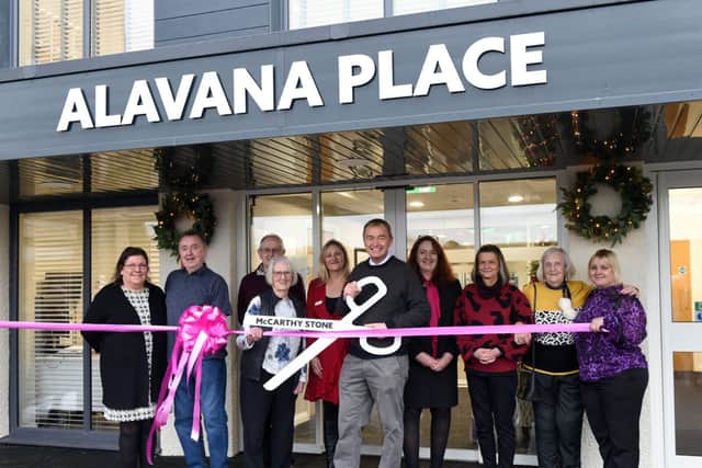 Tim Farron, McCarthy Stone staff and homeowners cut the ribbon to officially open Alavana Place