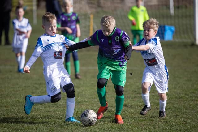 Under-9s match action between St Annes Yellows and Bispham JFF Phantoms