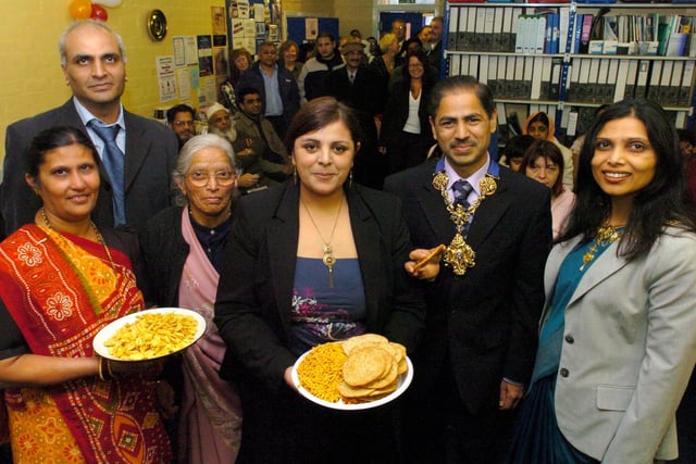 Bhanu Parmar from the Pukar Centre, Ashok and Mukhtaben Papat, and Nisha Patel from the Pukar Centre, and the Mayor and Mayoress of Preston celebrate at a Christmas, Eid and Diwali Party