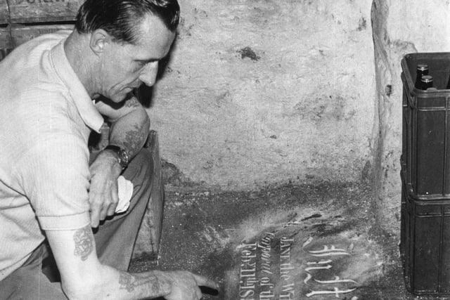 The Stone Cottage was a pub on Meadow Street and this intriguing image from 1971 shows a man inspecting a mystery inscription in the cellar - anyone remember what it was about? Or recognise the man in the picture?