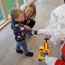 Registered Care Manager Katie Pennington with her son meeting Father Christmas at the event