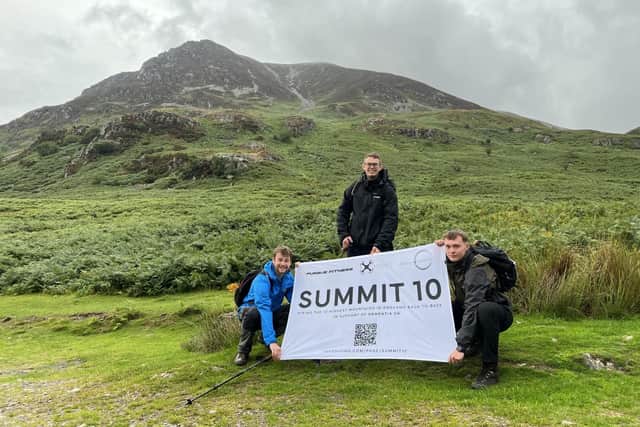 Peter McLay, James Sunter-Story and Bryn Catherwood at Grasmoor Mountain in the Lake District as part of their SUMMIT 10 challenge