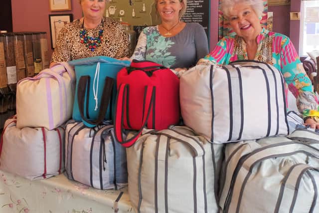 Kay Johnson (centre) pictured with Paula Gamester and Maureen Fazal from The Sewing Rooms at the thermal bag launch event at The Larder