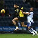 Preston North End's Duane Holmes battles with Watford's Jamal Lewis