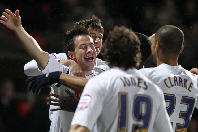 The Preston team join Sean St Ledger as he celebrates scoring early in the first half