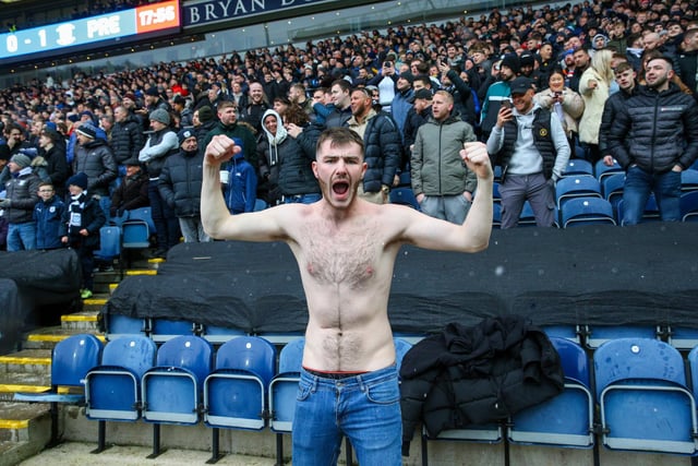 A North End fan braves the cold at Ewood Park.