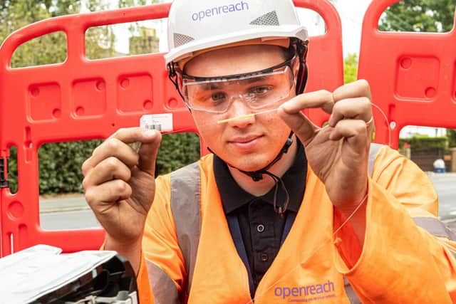 Openreach engineer hold up fibre