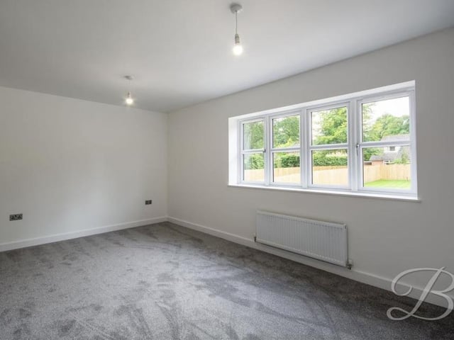 The third bedroom is also a good size. The floor is carpeted, while the window overlooks the back of the property.